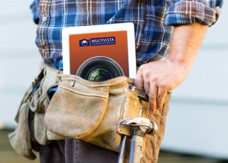 Worker using Multivista construction photo documentation app on tablet
