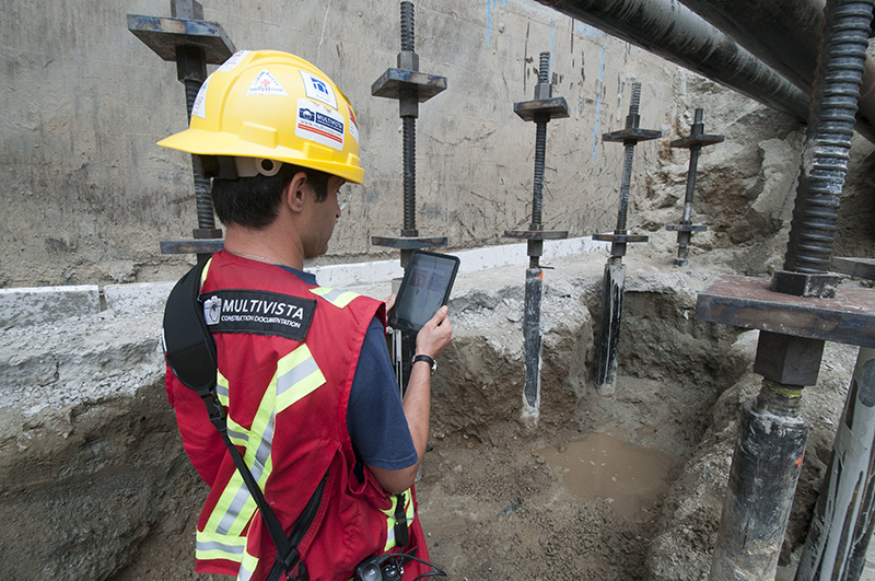 Multivista Worker Performing Photo Documentation on Construction Site