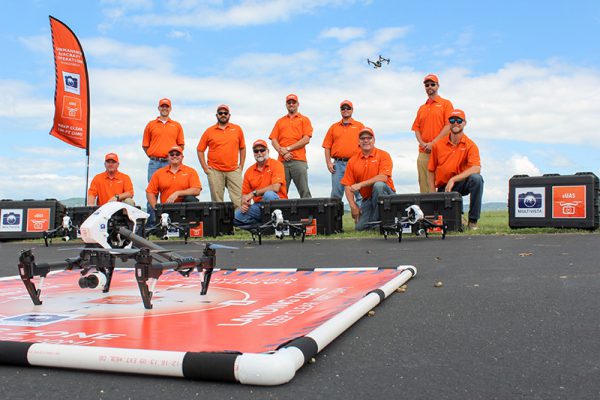 Multivista drone & UAV pilots posing with construction drones & UAVs