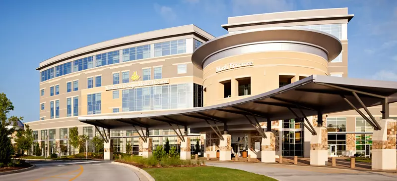 Modern hospital building with a prominent North Entrance drive-up area. Northeast Georgia Medical Center.