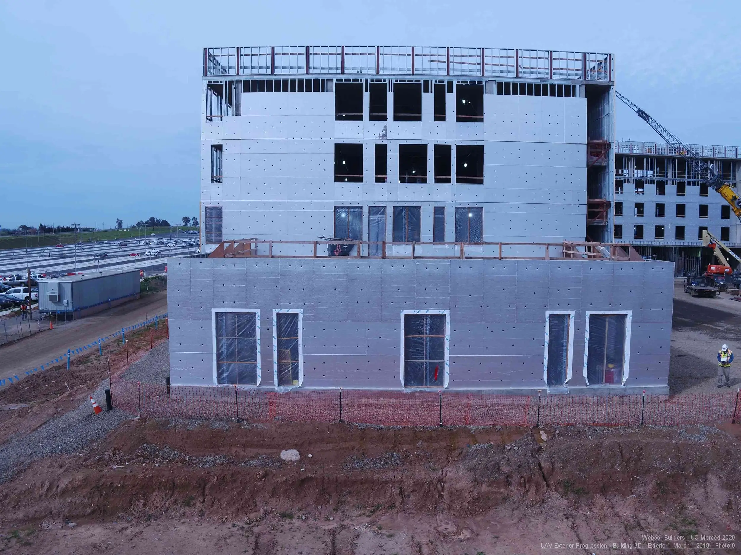 UAV mapping of a multi-story building construction, showing exterior facade progression.