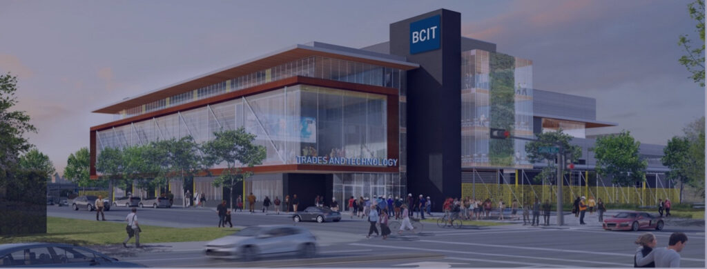 BCIT Trades and Technology Centre, a modern building with glass facades and a green wall, busy street.