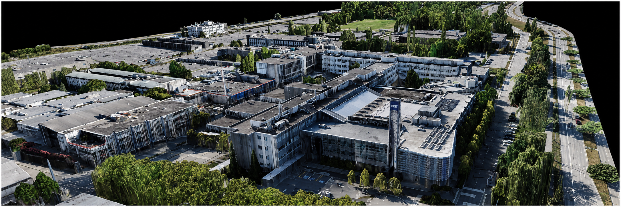 Aerial 3D model of BCIT campus, featuring multiple modern buildings, parking lots, and green landscaping.