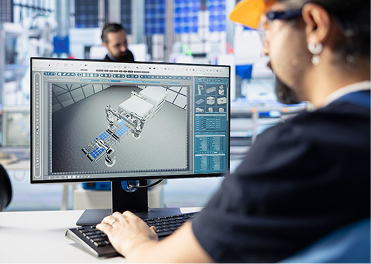 Engineer working on a 3D CAD model of a solar-powered robot in a lab.