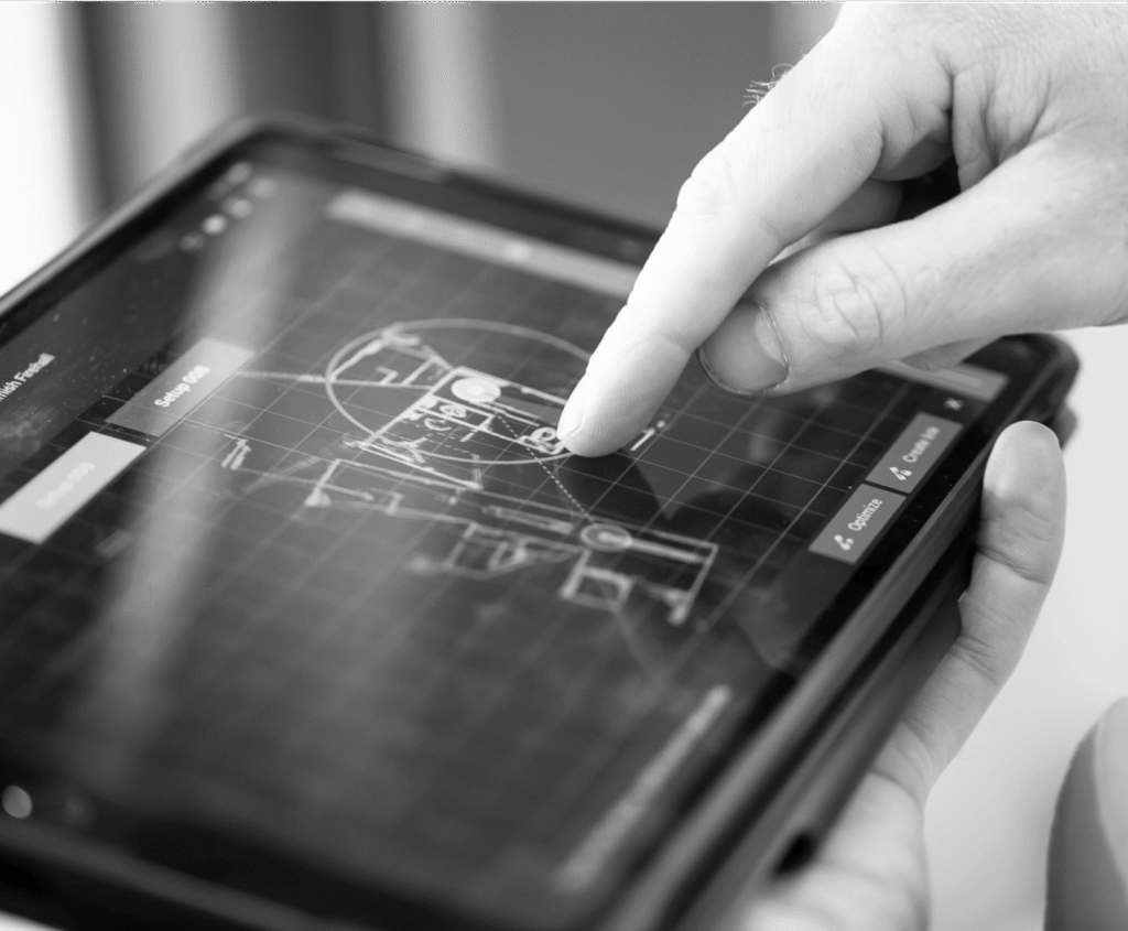Hand tapping a tablet screen displaying a digital blueprint with 'Setup' and 'Optimize' buttons.