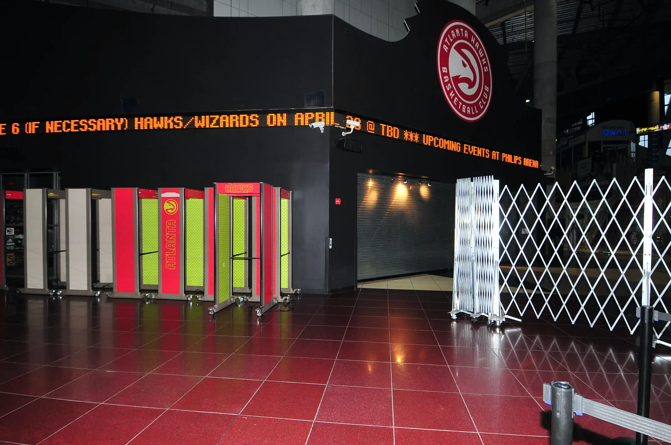 Atlanta Hawks arena entrance with security checkpoints and LED display announcing events at Philips Arena.