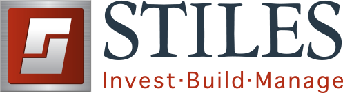 Stiles logo with a red square icon featuring a silver 'S' shape, and text 'STILES Invest · Build · Manage'.