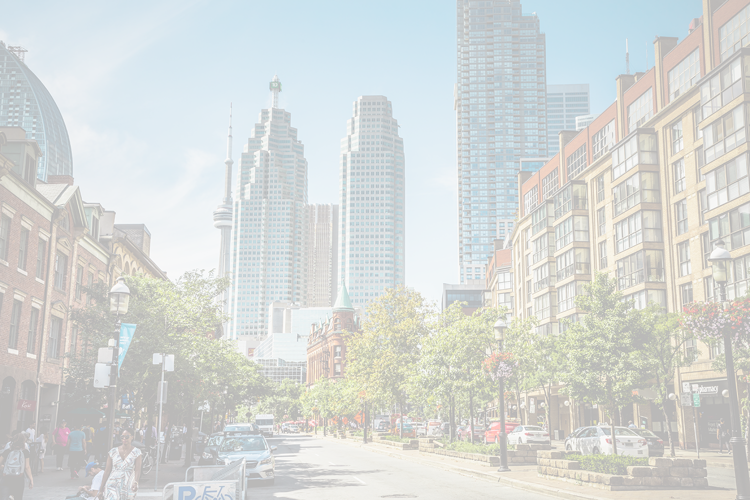 Vibrant Toronto street featuring CN Tower, skyscrapers, historic buildings, trees, and pedestrian activity.