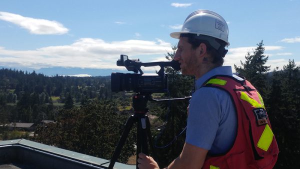 Multivista videographer performing video documentation on job site