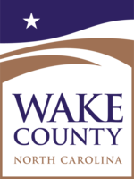 Official logo for Wake County, North Carolina, featuring a white star and brown waves.